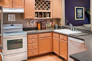 Large open concept kitchen photo in Richmond with white appliances