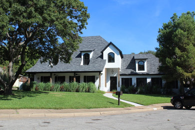 Inspiration for a mid-sized modern white two-story wood exterior home remodel in Dallas with a hip roof