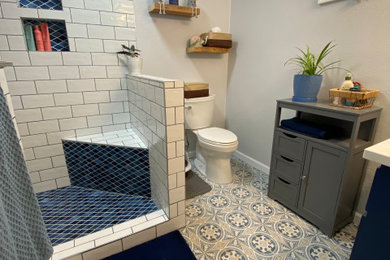 Example of a bathroom design in Other with blue cabinets