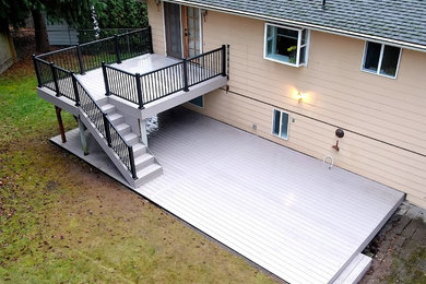 Design ideas for a mid-sized contemporary backyard deck in Seattle with no cover.