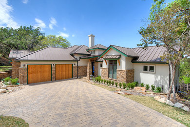 Inspiration for a mid-sized eclectic white one-story mixed siding exterior home remodel in Austin with a metal roof