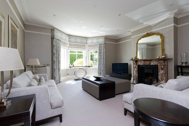 This is an example of a transitional living room in Essex.