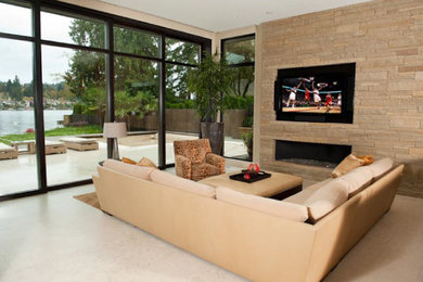 Example of a trendy family room design in Portland with a standard fireplace and a stone fireplace