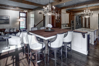 Inspiration for a traditional open plan dining in Chicago with grey walls, dark hardwood floors, brown floor and exposed beam.