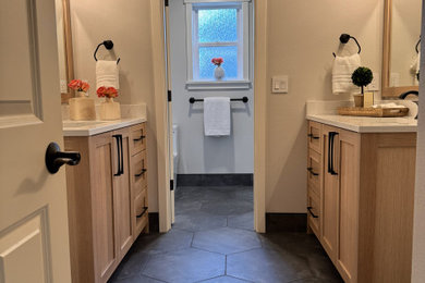 Inspiration for a transitional bathroom remodel in Seattle with light wood cabinets and quartz countertops