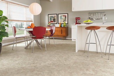 Inspiration for a mid-sized modern galley vinyl floor and gray floor open concept kitchen remodel in Other with an undermount sink, flat-panel cabinets, white cabinets, quartzite countertops, gray backsplash, stainless steel appliances and an island