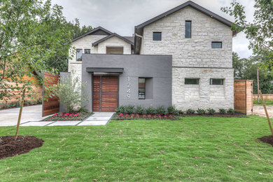 Large contemporary gray two-story stone gable roof idea in San Francisco
