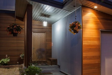 Inspiration for a mid-sized contemporary two-story mixed siding exterior home remodel in Vancouver