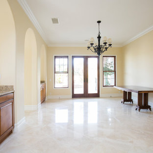 Photo of a medium sized mediterranean formal enclosed living room in Orange County with yellow walls, porcelain flooring, no fireplace, no tv and yellow floors.