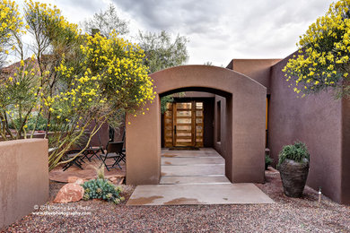 Example of a southwest home design design in Other