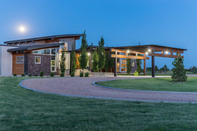 Large minimalist two-story stone exterior home photo in Phoenix
