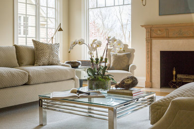 Example of a mid-sized classic formal and enclosed light wood floor living room design in Miami with beige walls, a standard fireplace, a stone fireplace and no tv
