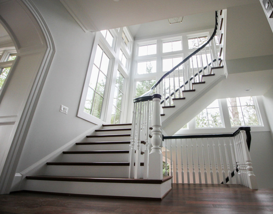Powerful Impression by Floating Staircase in Suburban Foyer
