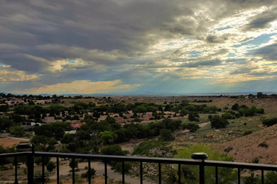 Small trendy metal railing balcony photo in Albuquerque with no cover