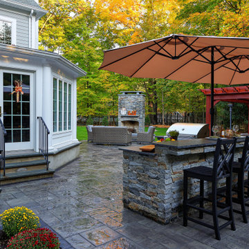 Make a Statement with a Versatile Outdoor Kitchen and Double Fire Feature