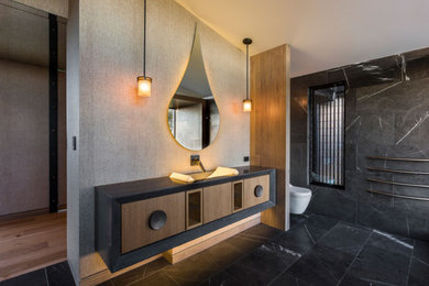 Huge asian master single-sink bathroom photo in Orange County with flat-panel cabinets, medium tone wood cabinets and a floating vanity