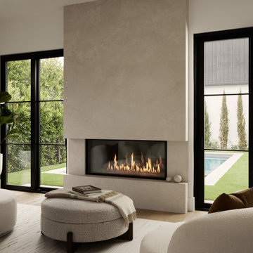 Ambient Master Suite Framed by Fireplace and Serene Outdoor Connection