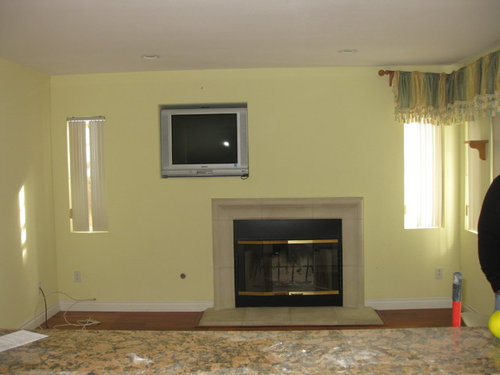 How to get rid of the TV opening above the fireplace