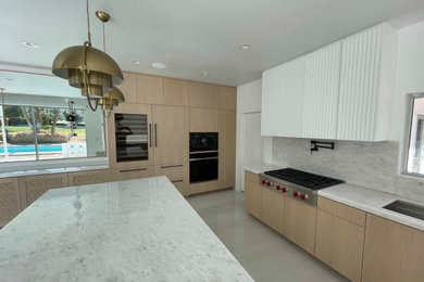 Example of a mid-sized minimalist kitchen design in Other with shaker cabinets