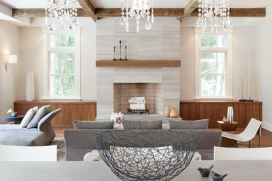 Inspiration for a large transitional open concept medium tone wood floor living room remodel in Boston with gray walls, a standard fireplace and a stone fireplace