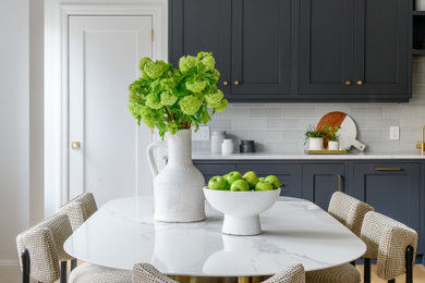 Transitional light wood floor kitchen/dining room combo photo in New York with white walls and no fireplace
