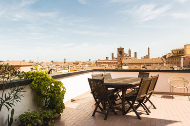 Photo of a mid-sized scandinavian rooftop deck in Bologna.