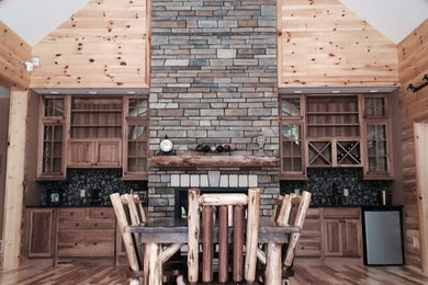 Inspiration for a mid-sized craftsman medium tone wood floor entryway remodel in Other with a light wood front door