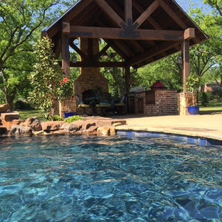 Photo of a mid-sized country backyard patio in Austin with a fire feature, concrete pavers and a gazebo/cabana.
