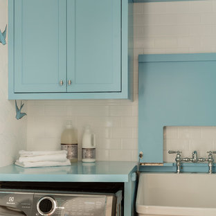 Inspiration for a small traditional single-wall separated utility room in Boston with an utility sink, shaker cabinets, blue cabinets, wood worktops, white walls, medium hardwood flooring, a side by side washer and dryer, brown floors and blue worktops.