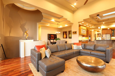 Inspiration for a large modern formal and open concept dark wood floor living room remodel in Albuquerque with beige walls and no fireplace