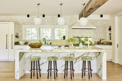 Example of a kitchen design in New York with a drop-in sink, beaded inset cabinets and ceramic backsplash