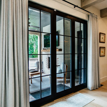 Functional drapes with 2-Finger Pinch Pleat on a Matte Black Traverse Rod