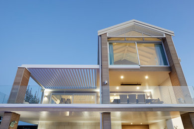 This is an example of an expansive contemporary home design in Other.
