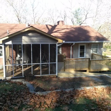 screened in porch with metal roof, deck and handicap ramp
