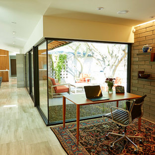 Design ideas for a modern study in Phoenix with limestone flooring and a freestanding desk.
