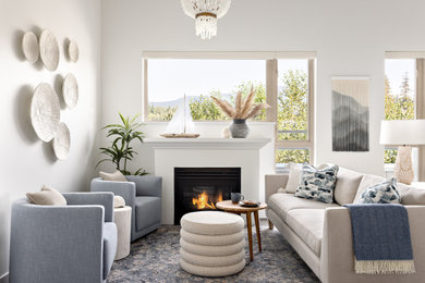 Living room - mid-sized coastal open concept beige floor living room idea in Vancouver with white walls, a standard fireplace and a plaster fireplace