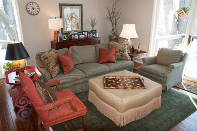 Inspiration for a mid-sized eclectic open concept medium tone wood floor living room remodel in Other with beige walls