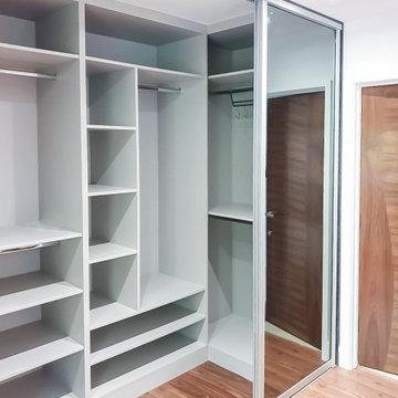 Stylish Walk-in Wardrobe with Sliding Mirror Doors in Stanmore