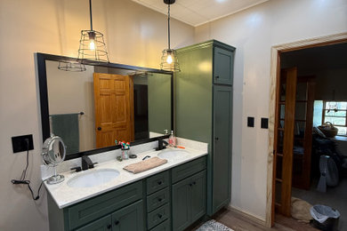 Bathroom - large traditional master laminate floor, brown floor, double-sink and shiplap ceiling bathroom idea with raised-panel cabinets, green cabinets, an undermount sink, white countertops, a freestanding vanity and quartz countertops