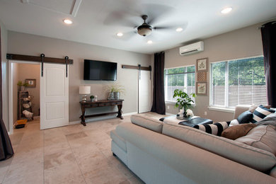 Inspiration for a large timeless ceramic tile and beige floor game room remodel with no fireplace and a wall-mounted tv