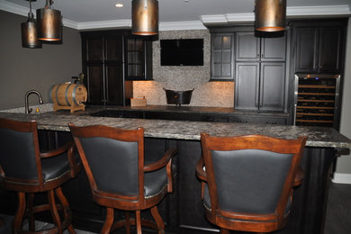Inspiration for a mid-sized timeless u-shaped dark wood floor seated home bar remodel in Baltimore with an undermount sink, recessed-panel cabinets, black cabinets, granite countertops, beige backsplash and mosaic tile backsplash
