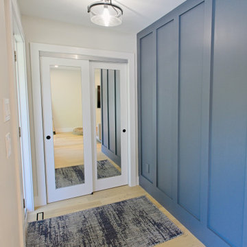 Blue Foyer Panelling Opposite Mirrored Closet Doors | North York
