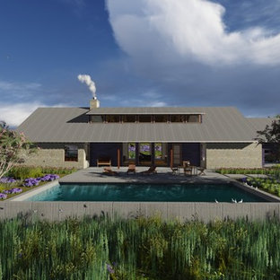 ヒューストンの中サイズの長方形サンタフェスタイルのおしゃれな前庭プール (コンクリート板舗装 ) の写真