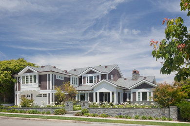 Large traditional brown two-story wood house exterior idea in Los Angeles with a hip roof and a shingle roof