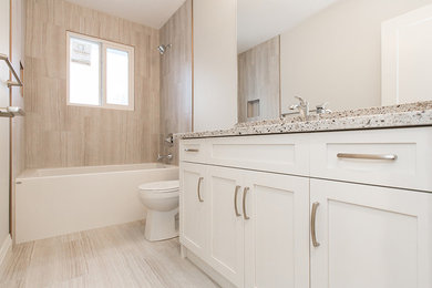 Example of a transitional home design design in Edmonton
