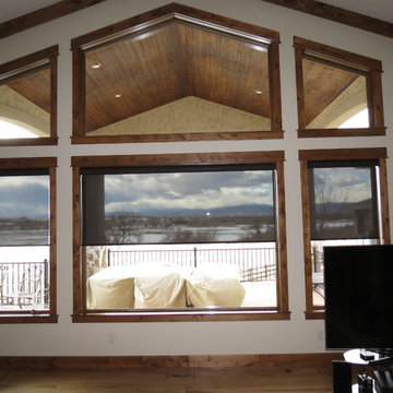 Motorized screen shades control the glare/preserve the view