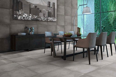 Large minimalist concrete floor dining room photo in Los Angeles with gray walls and no fireplace