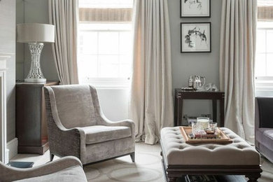 Photo of a large contemporary enclosed living room in London with beige walls, light hardwood floors, no fireplace and no tv.