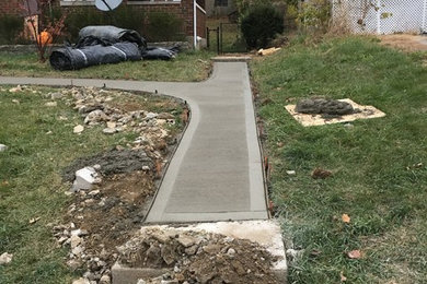 Front porch with concrete walkway to boost home sale.