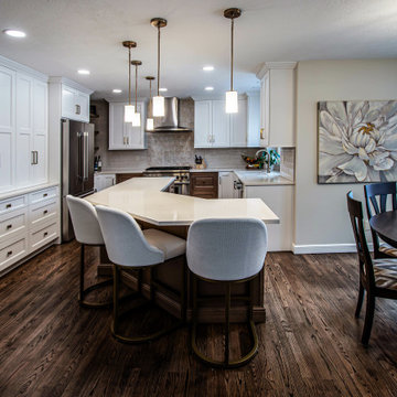 Two Tone Kitchen with Floating Shelves and Island Seating and Updated Fireplace
